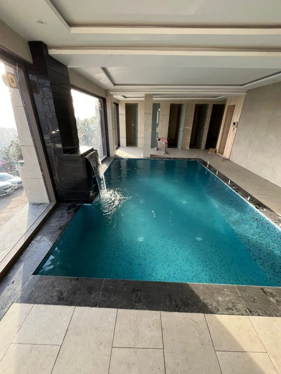 Swimming pool under construction showing tiling and coping detail, Zirakpur