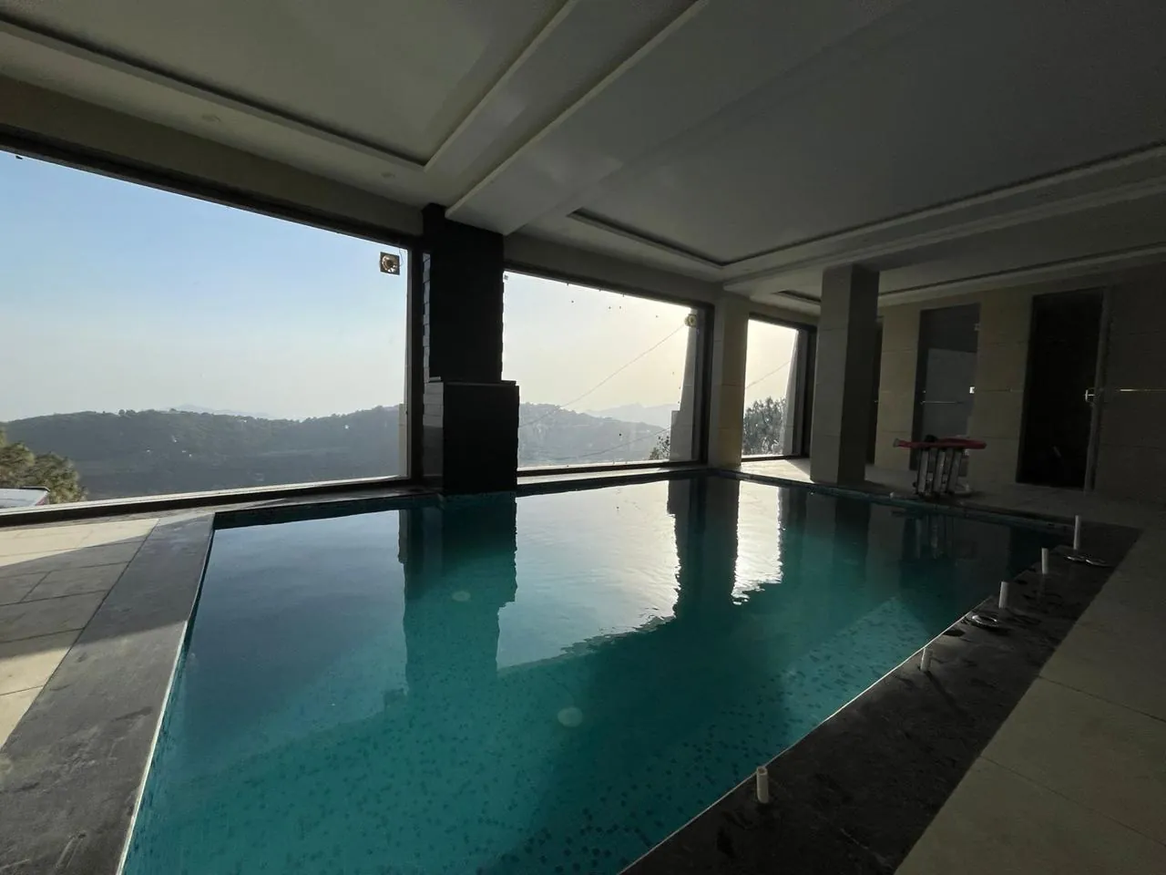 Residential swimming pool with underwater lighting near Chandigarh